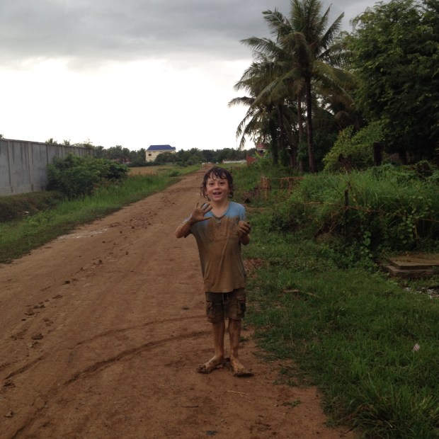 When it rains, Quinn makes the most of it ! Street outside our house